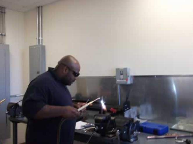 Man working with welding tools in workshop