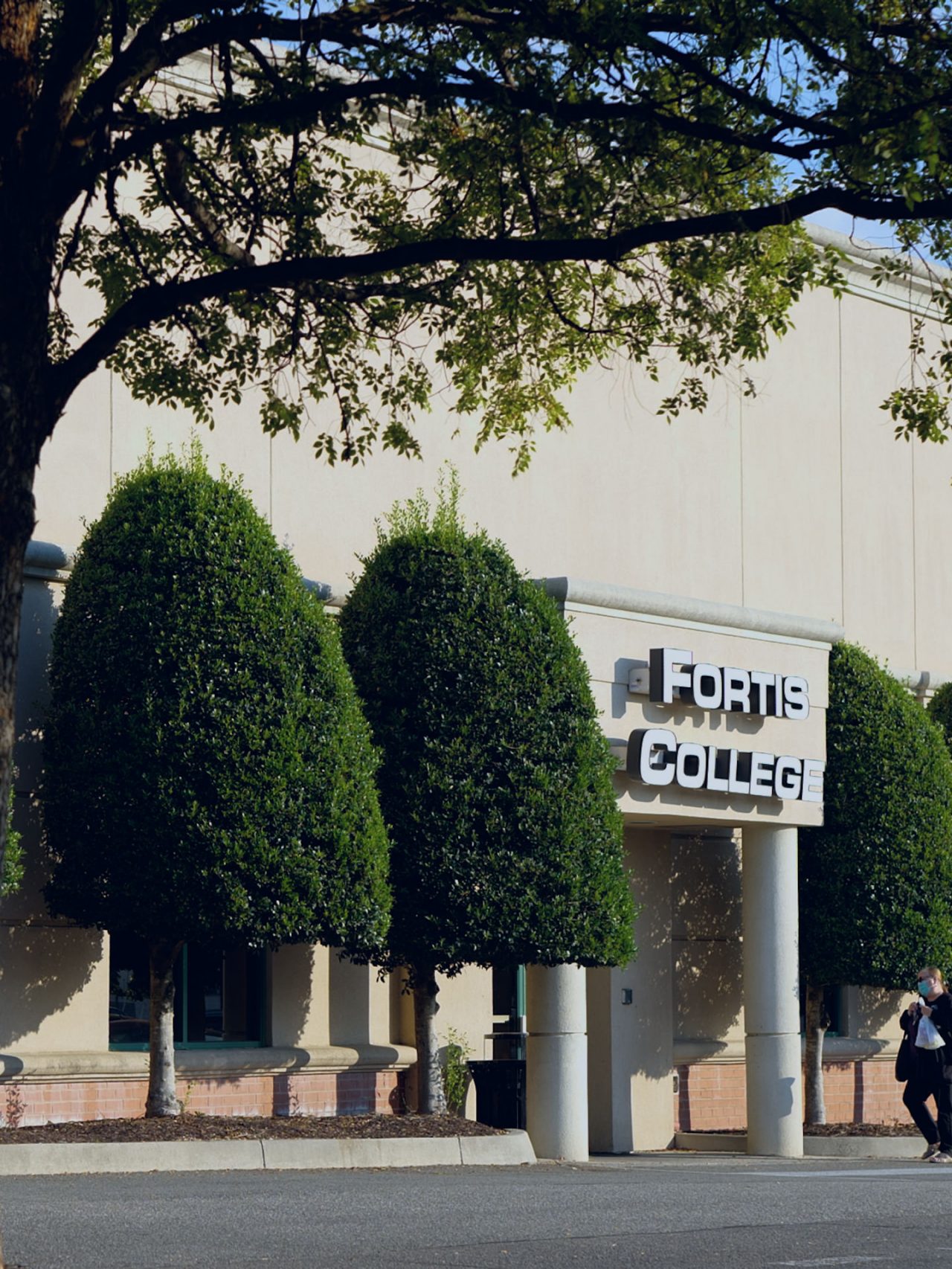 Fortis College building exterior with trees